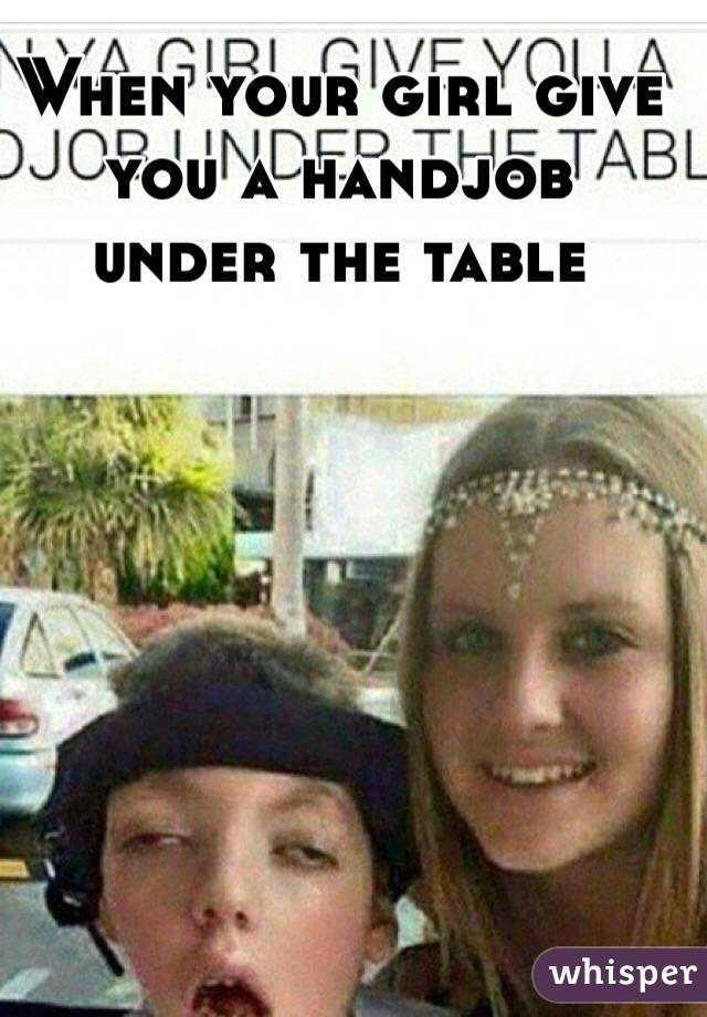 Giving handjob under table
