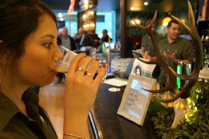 Woman drinkin a pint of sperm